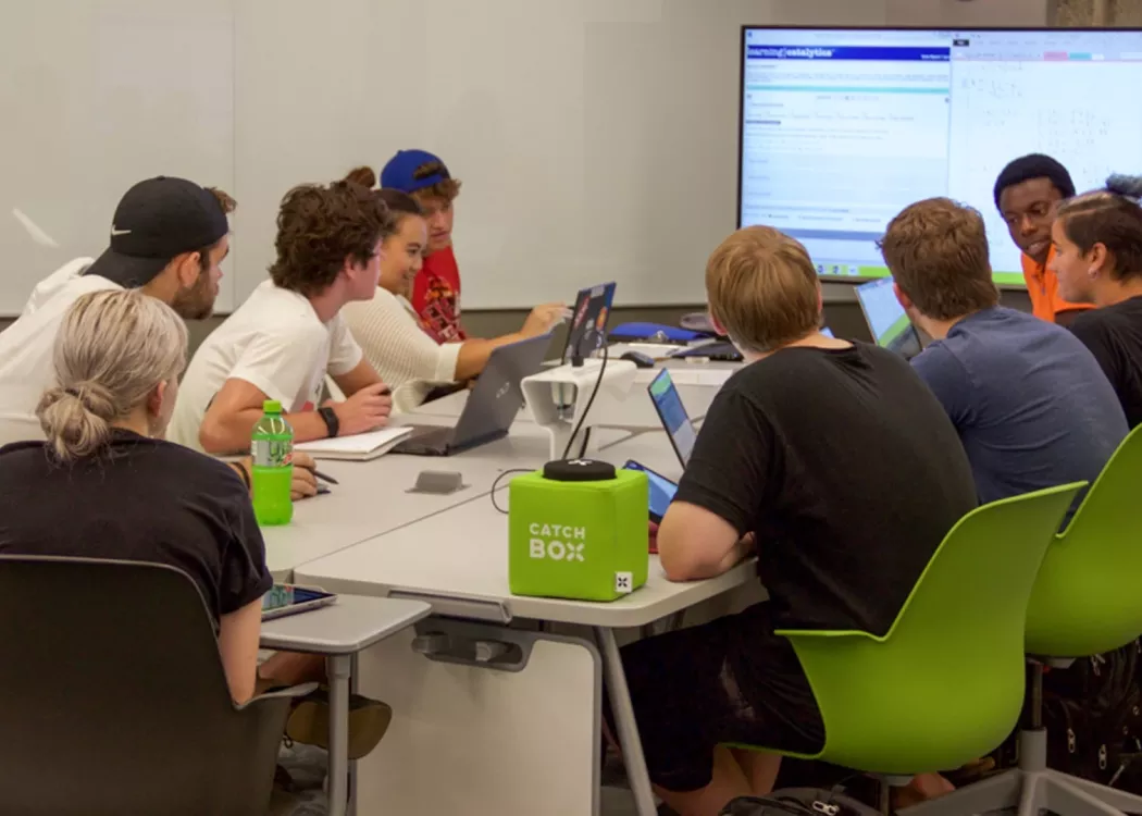 Students collaborating together at table in the TILL Classroom