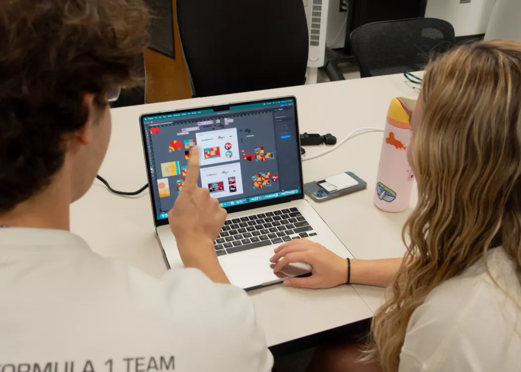 Students working together on computer.